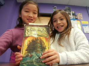 Students with House of Secrets book